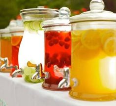 several jars filled with liquid sitting on top of a table