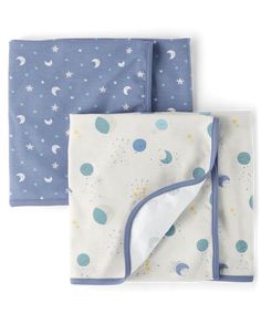 two blue and white baby blankets with stars, crescents and moon designs on them