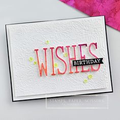 a handmade birthday card with the words wishes written in pink and green on it