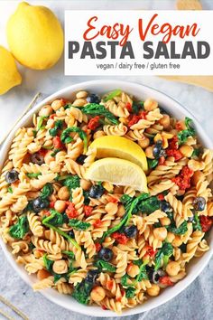 pasta salad in a white bowl with lemons on the side and text overlay that reads easy vegan pasta