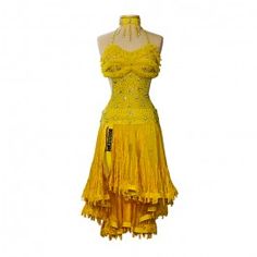 a yellow dress on a mannequin stand