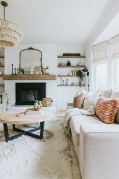 a living room filled with furniture and a fire place