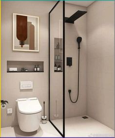 a white toilet sitting next to a shower with a black faucet in it