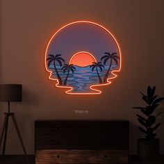 a neon sign with palm trees and the ocean in the background that says wild life