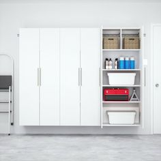 a room with white cupboards and shelves filled with various items, including plastic containers