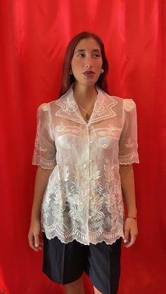 Amazing sheer short-sleeve shirt. Intricately with floral lace embroidery throughout, scallop edging at the Notch collar, sleeves and hemline. Made of sheer tulle with visible shoulder pads and finished with pearl buttons & loop fastening.  Size tag: Medium Classic Sheer Collared Tops, Sheer Short Sleeve Summer Top, Elegant Short Sleeve Lace Tops, Feminine Summer Blouse With Lace Collar, Summer Collared Lace Tops, Summer Lace Collared Tops, Collared Lace Tops For Summer, Summer Lace Blouse With Lace Collar, Short Sleeve Lace Top For Spring Formal