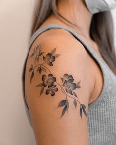 a woman with a tattoo on her arm