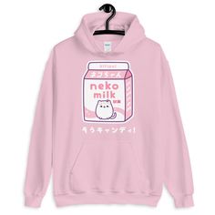 A super kawaii hoodie featuring a carton of pink kitty cat milk. This hooded sweatshirt looks great on both men and women. Perfect for people who love drinking milk with their cat. Runs large for women. Fits men true to size. Lined hood Double stitched throughout Soft Has a pocket Runs large for women Reduced pilling Plus sizes available Original artwork not available in stores Sizing tip: Take a shirt that fits you the way you like, lay it flat and measure the width (from under one arm to under Plus Size New Years Eve Outfits, Japanese Hoodie, Cute Nerd, Kawaii Hoodie, Kawaii Sweatshirt, Drinking Milk, Pink Kitty, Baggy Sweaters, Hoodie Cute