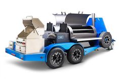 a blue and white truck with an oven on the back