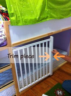 a child's room with bunk beds and a crib on the floor next to it