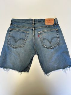 Ladies Levis Denim Short cut off Mid Stonewash Waist 32 inch Length 7 inch Vintage 1990s Made Denim Item in excellent Condition Distressed Medium Wash Short Leg Jeans, Medium Wash Distressed Short Leg Jeans, 90s Cutoff Jeans With Pockets, Jean Levis, Levis Denim Shorts, Short Cut, Levis Denim, Denim Short, How To Make Shorts