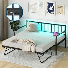 a bed with a light up headboard and foot board in the middle of it