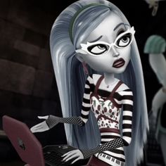 a cartoon girl with long hair and eye makeup is typing on a laptop computer while another doll stands behind her