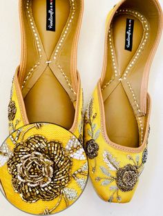 Timeless beauty is 'YELLOW VIBES' to be clubbed with any outfit to get the stunning glaze. This subtle yellow jutti with bulge beads, beads, zari embroidery is a contemporary classic pair of juttis which is a perfect accompaniment to just about anything. *Perfect for wedding and as bridesmaid gift. *Perfect for haldi ceremony. *Ethnic Shoes/Women Flats/Handmade Indian Designer Women Shoes or Slippers/Royal shoes/traditional style Women SPECIFICATIONS: *Upper/Panna -Yellow silk fabric base with g Slip-on Flats With Mirror Work For Wedding, Diwali Reception Flats, Festive Zari Work Flats For Reception, Festive Flats With Zari Work For Reception, Festive Flats With Gota Work For Reception, Bollywood Style Festive Flats For Reception, Festive Cutdana Flats For Reception, Dori Work Flats For Wedding And Diwali, Zari Work Flats For Diwali Reception