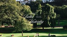 people sitting on the grass in a park with trees and buildings in the background that says, better than wednesday