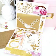 the inside of a card box with some paper and crafting supplies around it on a table