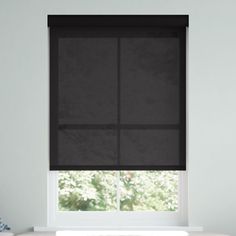 a window with black shades in a white room