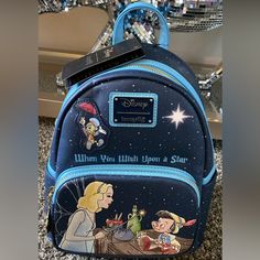 Bnwt Never Used Adorable Pinnochio Mini Backpack By Loungefly. Beautiful Colors Of Blue With Pinnochio Wishing! This Backpack Is Perfect For Any Disney Fan! Blue Backpack With Dust Bag For Everyday Use, Blue Backpack With Case For Everyday Use, Blue Backpack With Detachable Strap, Colors Of Blue, Inspired Clothes, Disney Mickey Ears, Loungefly Bag, Cell Phone Holster, Phone Holster