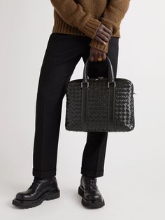 Bottega Veneta's briefcase has been handcrafted in Italy from dark-green leather using the label's intrecciato technique, the signature weave makes the hide much more durable. It has a neat slim profile and is fitted with a detachable shoulder strap so you can alternate between that and the top handles. High-end Black Leather Briefcase, Designer Leather Briefcase For Business Meetings, Designer Textured Leather Briefcase For Business, Designer Textured Leather Briefcase For Work, Designer Textured Leather Briefcase, Black Woven Leather Business Bags, Designer Leather Briefcase For Business, Designer Leather Briefcase With Leather Handles, Leather Briefcase Men