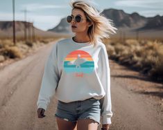 Our cozy retro style surf sweatshirt is perfect for cool nights on the beach after a day of surfing.. It's soft and cozy and sure to be a well loved favorite any time of year. A great gift for the surfer in your life. The sweatshirt is an adult unisex, heavy blend crewneck. - Medium-heavy fabric (8.0 oz/yd² (271.25 g/m - Loose fit - Sewn-in label - Runs true to size Returns and Exchanges: As our shirts are made to order, we do not accept returns or exchanges. If you have any questions, please reach out. We're more than happy to answer any questions. If there is an issue with the printing of your shirt please reach out with photos and we will resolve this with our printer. Casual Cotton Sweatshirt, Casual Cotton Sweatshirt For Surfing, Casual Crew Neck Sweatshirt For Surfing, Casual Graphic Print Sweatshirt For Surfing, Sporty Crew Neck Sweatshirt For Surfing, Vacation Surfing T-shirt With Crew Neck, Crew Neck T-shirt With Sublimation Print For Surfing, Sporty Crew Neck T-shirt For Surfing, Relaxed Fit Crew Neck T-shirt For Surfing