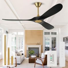 a ceiling fan in the middle of a living room