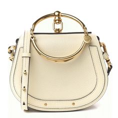 Chloe Calfskin Suede Small Nile Bracelet Bag. Off White Color. Brand New. Measurements Longest Length : 7.5 In Height: 6.25 In Width: 2.5 In Drop: 5.5 In Drop: 20.25 In Comes With: Dust Bag, Strap Luxury Beige Shoulder Bag With Brass Hardware, Modern Beige Bags With Brass Hardware, Designer Beige Bags With Brass Hardware, Designer Cream Bag With Metal Hardware, Leather Bags With Gold-tone Hardware, Chic Beige Bags With Brass Hardware, Chic Bag With Gold-tone Hardware, Chic Cream Bags With Metal Hardware, Luxury Everyday Cream Shoulder Bag With Gold-tone Hardware