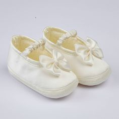 The perfect finishing touch to your baby’s very special ceremonial outfit is provided by these gorgeous special occasion baby shoes. Available in ivory and white, and including classic fabrics like silk dupion, satin and linen, these beautiful shoes will be a wonderful keepsake to remind you of that very special day. Eliza is available in white and ivory satin, it has an elasticated strap and features a matching satin bow on the front of the shoes. Made in England since 1952 White Wedding Shoes With Satin Bow And Round Toe, White Closed Toe Wedding Shoes With Satin Bow, White Wedding Shoes With Satin Bow, Special Occasion Shoes, Satin Bow, Beautiful Shoes, Bosnia And Herzegovina, Apparel Accessories, Baby Shoes