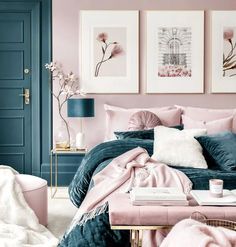 a bedroom with pink and blue walls, pictures on the wall and furniture in it