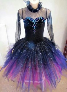 a mannequin wearing a black and purple dress with blue butterflies on the top