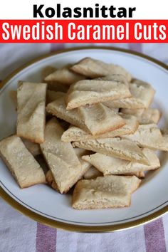 a white plate topped with cut up cookies