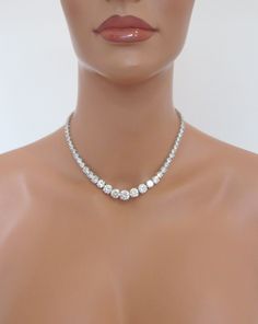 a mannequin wearing a diamond necklace on it's neck