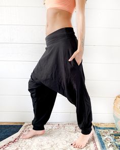 "Introducing new glorka ninja jogger pants design with a higher drop. Great as a casual wear, these avant garde pants are not as baggy as the original glorkas. Yet they are still super comfortable and made from the softest cotton blend. -Unisex -Stretch -Flowing relaxed fit -Inner drawstring to secure the waist -2 side pockets Wear it for Yoga, Dance, Exercises, Meditations, Yoga Practice and beyond... Materials: black color cotton blend (95% cotton 5% lycra). Fabric for this pair were bought in Avant Garde Pants, Mens Kimono Shirt, Dance Exercises, Ninja Pants, White Yoga Pants, Samurai Pants, Yoga Pants Men, Cotton Loungewear, Cotton Harem Pants