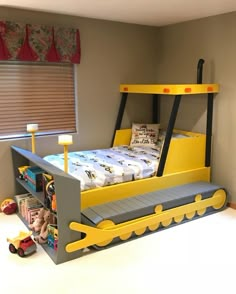 a child's bedroom with a bed made to look like a race car track