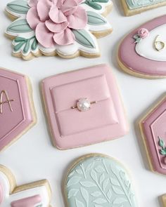 decorated cookies with pink and blue designs on them