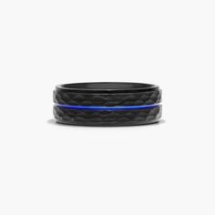 a black and blue ring with an intricate design