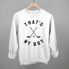 a white sweatshirt with the words that's my boy on it and two crossed hockey sticks