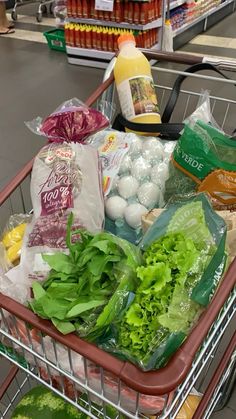 a shopping cart filled with lots of food