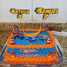 a birthday cake with hot wheels on it