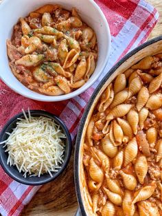 two bowls of pasta, one with meat and the other with cheese