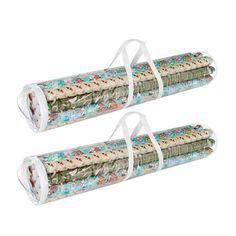 two rolls of christmas wrapping paper on top of each other, with the same design