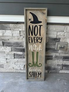 a wooden sign that says not every witch has an salem hat on it and green boots