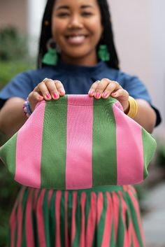 Your favorite summer clutch has arrived! Our knitted Seabrook clutch in pink and green adds the perfect pop of color to any outfit and is perfect for holding all of your essentials. The clutch measures 11.8" x 7.5" x 3.9". Green Beach Clutch For Summer, Pink Rectangular Clutch For Vacation, Rectangular Pink Clutch For Vacation, Green Pouch Clutch For Summer, Green Summer Beach Clutch, Green Rectangular Casual Clutch, Pink Summer Beach Clutch, Green Clutch For Everyday Use In Summer, Trendy Green Pouch Clutch