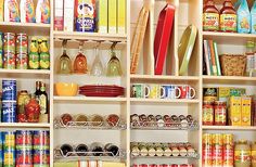 the shelves are filled with many different types of food and drink items, including canned foods