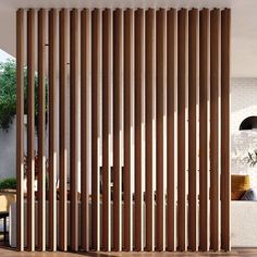 a living room with wooden slats on the wall