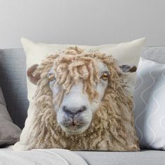 a sheep's face is shown on a pillow