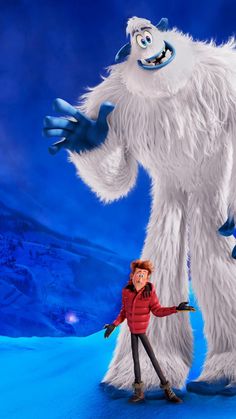 a man standing next to a giant furry creature