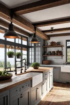 a kitchen with lots of counter space and hanging lights