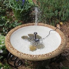 a bird bath with water coming out of it