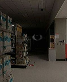 an eyeball is seen in the middle of a store aisle