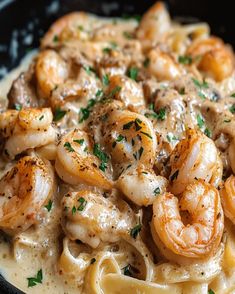 pasta with shrimp and sauce in a skillet